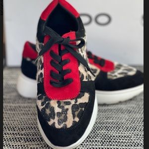 ALDO Cheetah sneakers with a touch of red.
